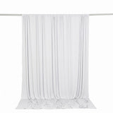 White sheer curtain panel hanging on a rod with soft flowing drapes