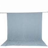 Light blue fabric backdrop with floor sweep on support stand