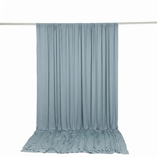 Light blue sheer curtain draped on a rod against a white background