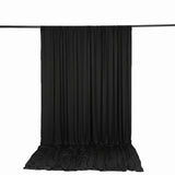 Black photography backdrop curtain with floor drape on crossbar stand