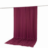 Burgundy draped backdrop curtain on a crossbar stand