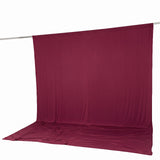 Maroon fabric backdrop with floor sweep on studio support rod#whtbkgd