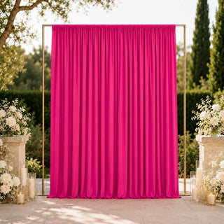 Hot pink wedding backdrop with gold frame and white floral arrangements