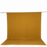 Mustard yellow fabric backdrop and floor cloth on a studio backdrop stand