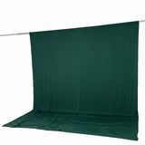 Dark green photo backdrop with floor sweep on a support rod#whtbkgd