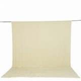 Cream seamless fabric backdrop on studio stand with floor sweep