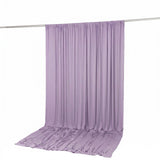 Lavender purple draped fabric backdrop on a studio rod
