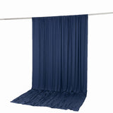 Navy blue backdrop curtain on hanging rod, photography studio background