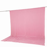 Pink fabric backdrop hanging on a studio rod with floor sweep#whtbkgd