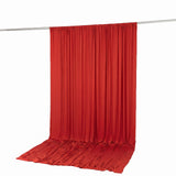 Red draped fabric backdrop hanging on a silver rod, studio background