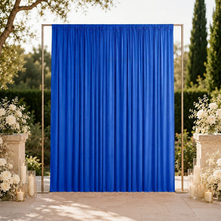 Blue wedding backdrop with gold frame and white floral arrangements outdoors