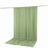 Light green curtain fabric draped on a rod, isolated on white background