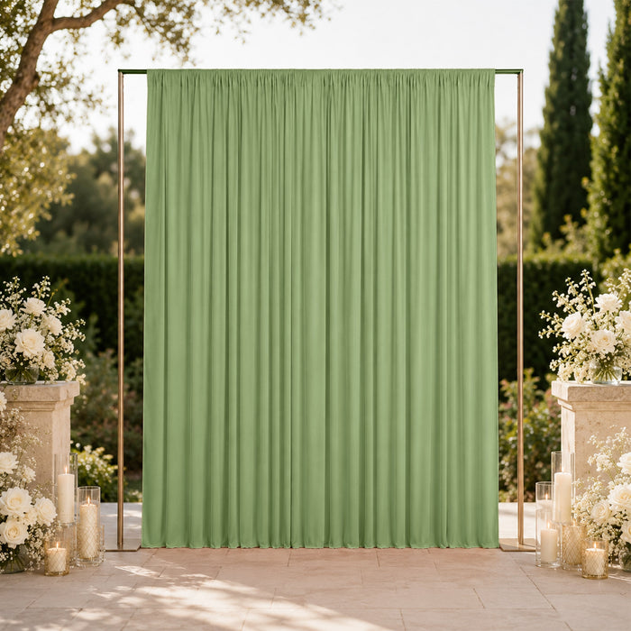 Elegant green wedding backdrop with floral arrangements and candles