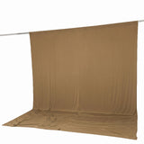 Tan fabric backdrop draped over a photography stand with floor sweep#whtbkgd