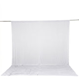 White photography backdrop with seamless floor and support rod