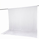 White seamless fabric backdrop hanging on a support rod#whtbkgd