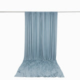 Light blue draped fabric backdrop with wrinkled floor sweep on white background