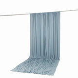 Light blue draped curtain on a rod against a white background