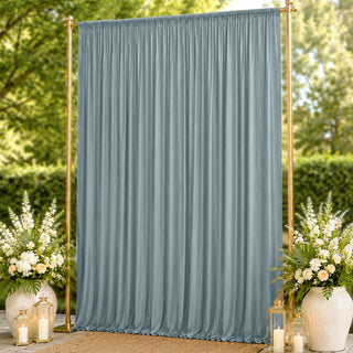 Blue-gray pleated outdoor curtain backdrop with gold frame and floral decor