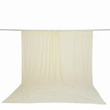 Cream sheer fabric backdrop curtain hanging on a rod, studio photo backdrop