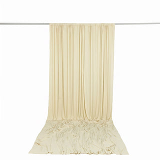 Cream pleated curtain drape on rod with matching floor-length backdrop