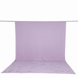 Light purple fabric backdrop draped on studio backdrop stand