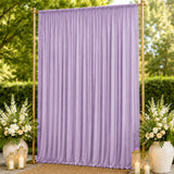 Lavender pleated wedding backdrop with gold frame and floral lantern decor