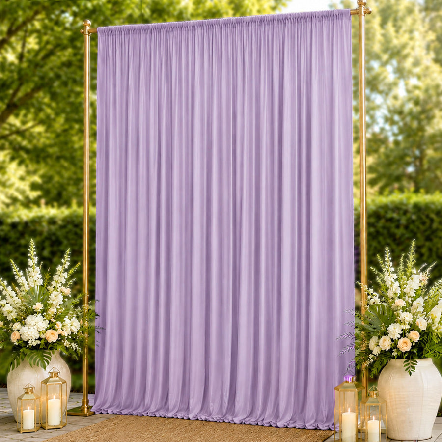 Lavender pleated wedding backdrop with gold frame and floral lantern decor