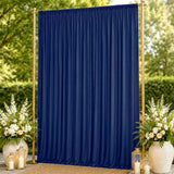 Elegant navy blue wedding backdrop with gold frame and floral arrangements