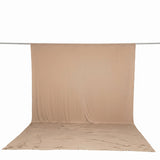 Beige fabric backdrop and floor mat on seamless studio backdrop