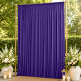 Purple draped wedding backdrop with gold frame and floral decor