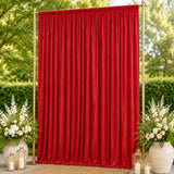 Red wedding backdrop curtain with gold frame, floral arrangements, and lanterns