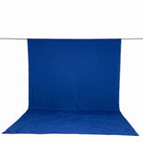 Blue photography backdrop with floor sweep on studio support bar
