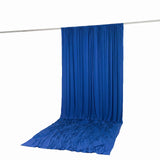 Blue draped fabric backdrop on a hanging rod for event display