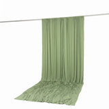 Light green draped backdrop curtain on a hanging rod