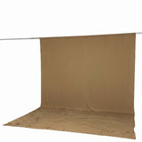 Beige fabric backdrop on hanging rod with floor extension#whtbkgd