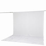 White sheer curtain backdrop on a hanging rod with floor drape#whtbkgd