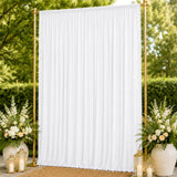 Gold frame white draped wedding backdrop with floral arrangements and lanterns