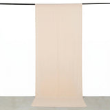 Beige sheer curtain panel hanging on black rod, minimalist home decor