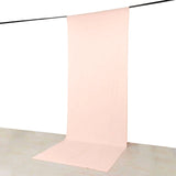 Pink seamless photography backdrop with floor sweep on hanging rod
