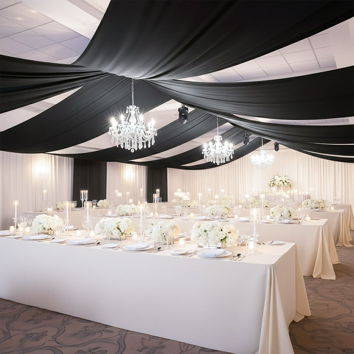Elegant banquet hall setup with chandeliers and floral centerpieces.