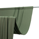 Olive green fabric draped on a rod, showcasing smooth texture and flow. #whtbkgd