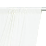 White curtain draped on a rod, showcasing soft fabric texture.
