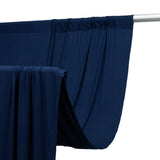 Navy fabric draped on a rod, showcasing its smooth texture and flow. #whtbkgd
