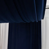 Navy draped fabric in a studio setting