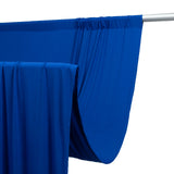 Blue fabric draped on a rod, showcasing its smooth texture and vibrant color. #whtbkgd