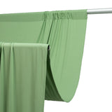 Green fabric draped over a rod, showcasing its smooth texture and flow. #whtbkgd