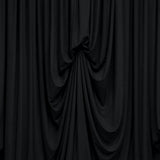 Black draped fabric curtain with elegant folds and shadows