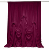 Burgundy velvet stage curtain with elegant draped folds