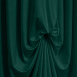 Abstract dark green draped fabric texture with flowing folds#whtbkgd